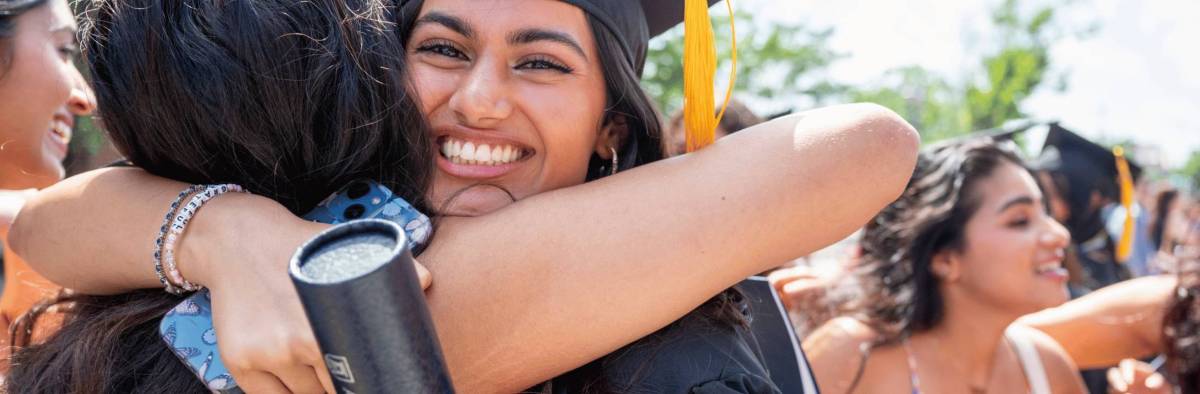 grateful graduate hugging