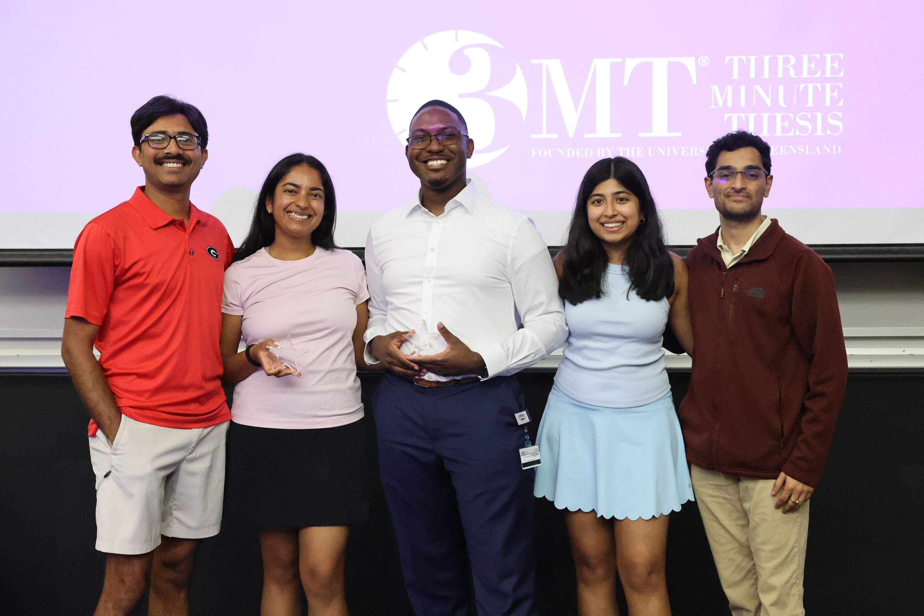 2026 Gradpitch winners stand and smile at the camera, holding their awards
