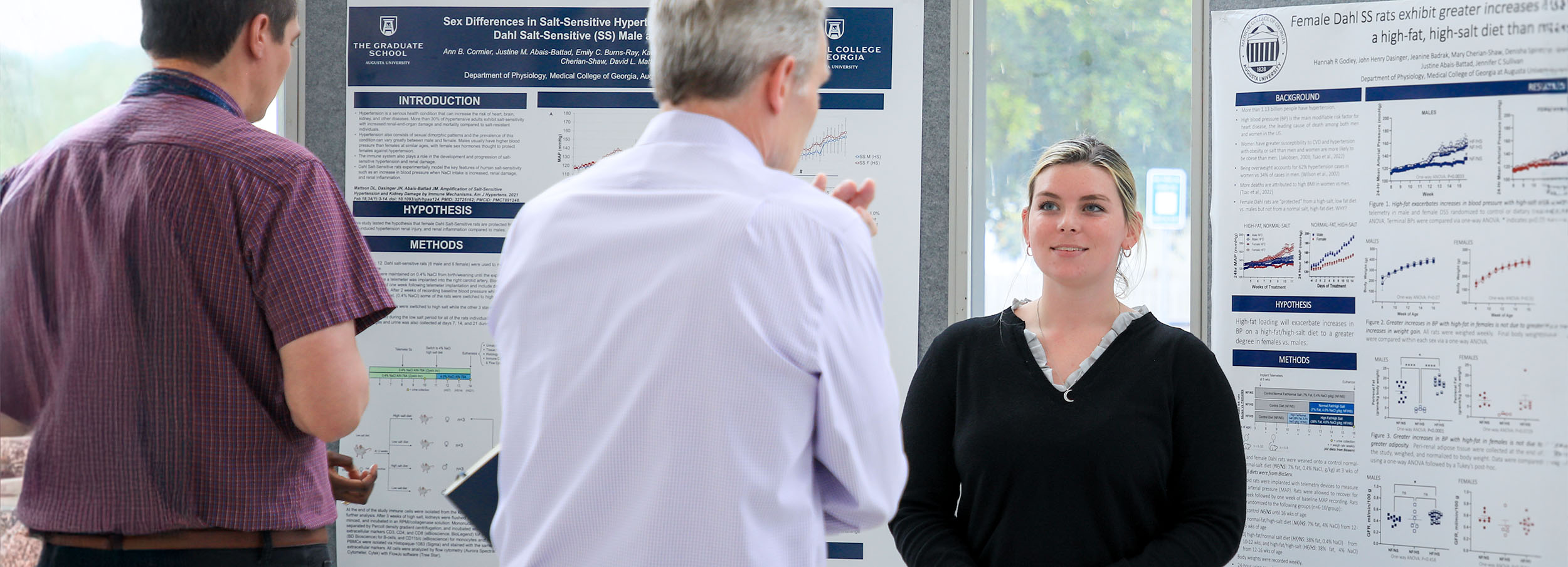 image of student presenting poster