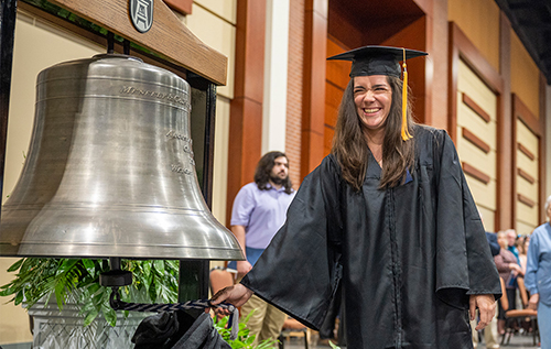 Graduate rings the AU bell to kick off Commencement