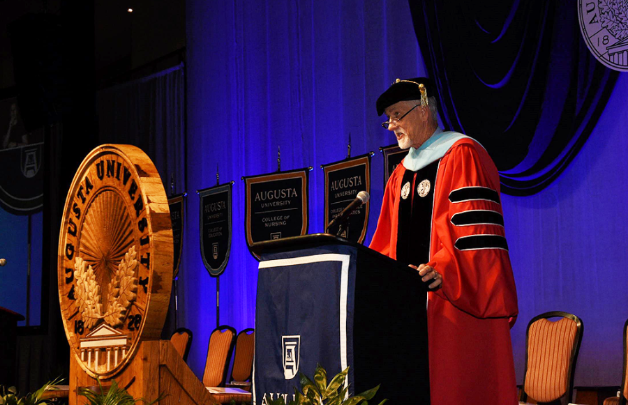Dr. Kelehear speaking at podium