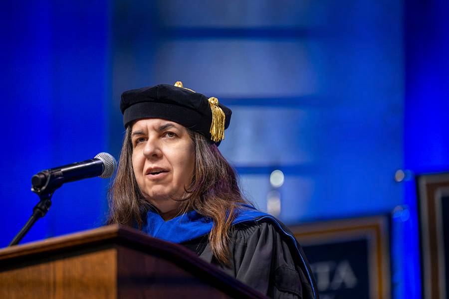 woman speaking at podium