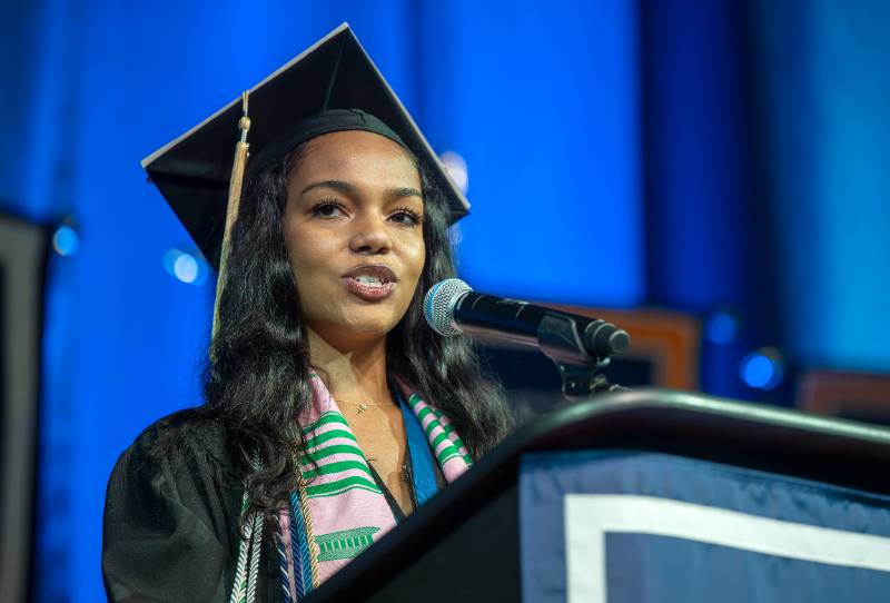woman speaking at podium
