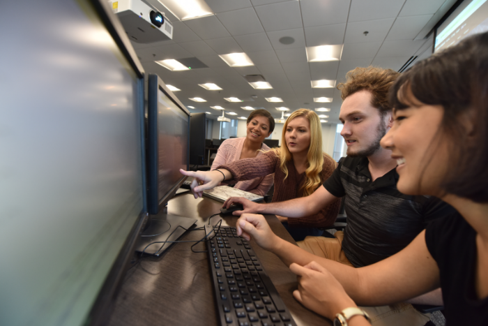 students looking at computer 