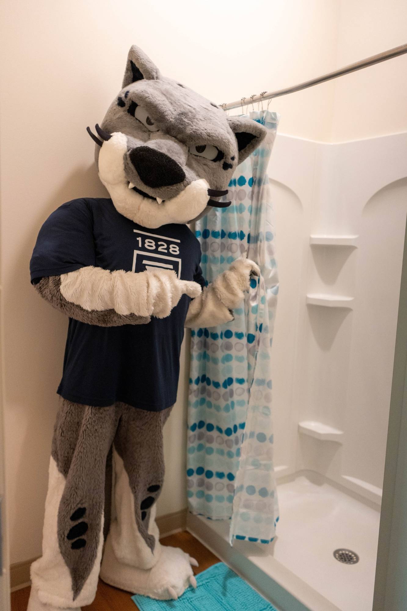 Augustus showing what an Oak Hall bathroom looks like.