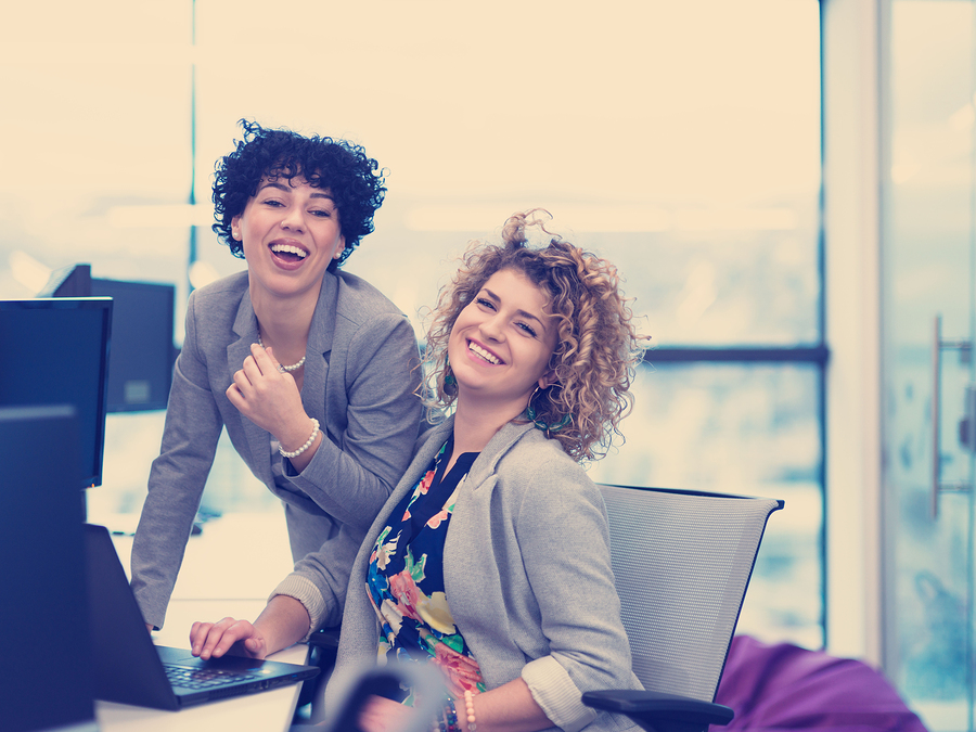 Two female professionals at a computer