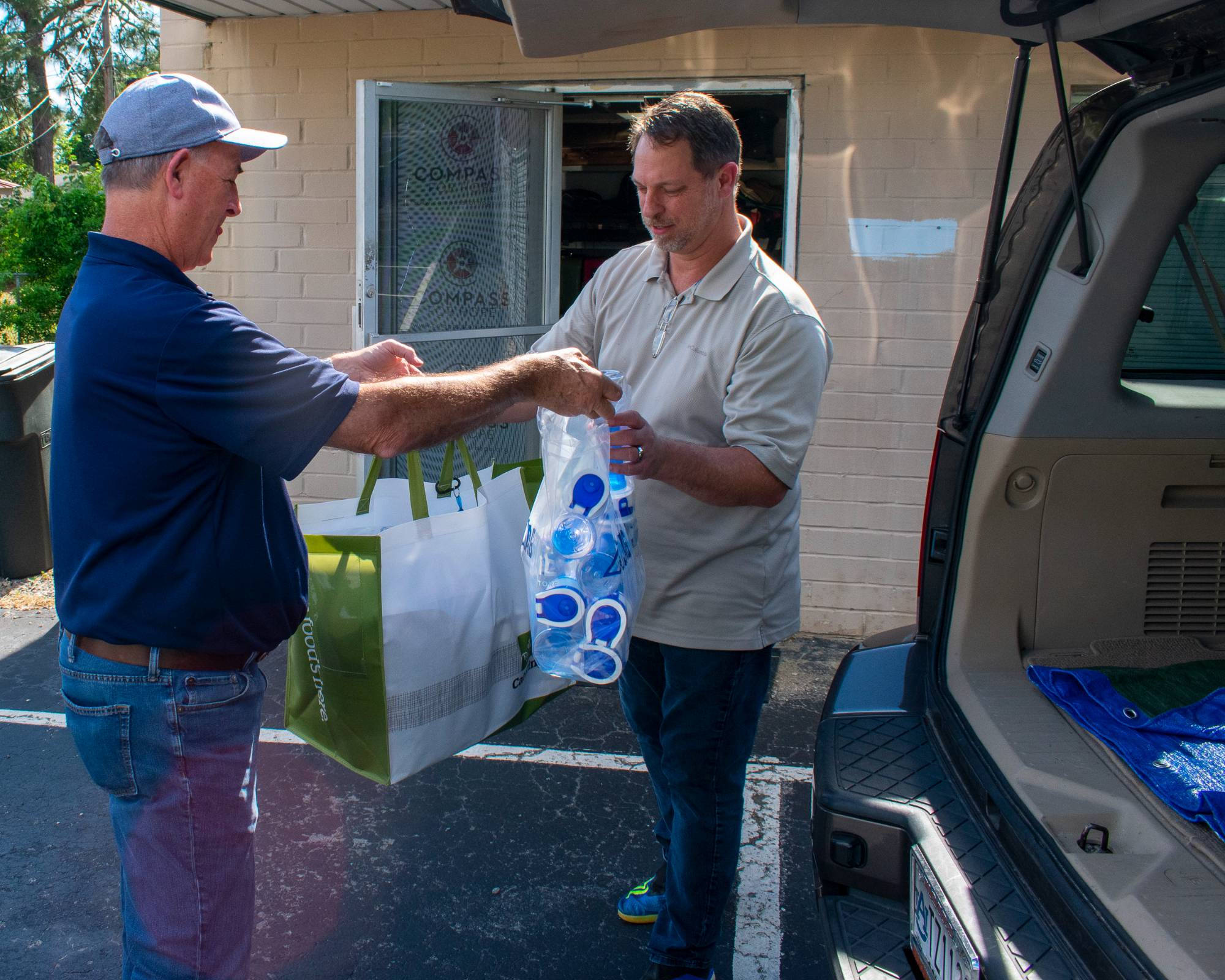 Roger Duke delivering donation items to Compass for Hope 
