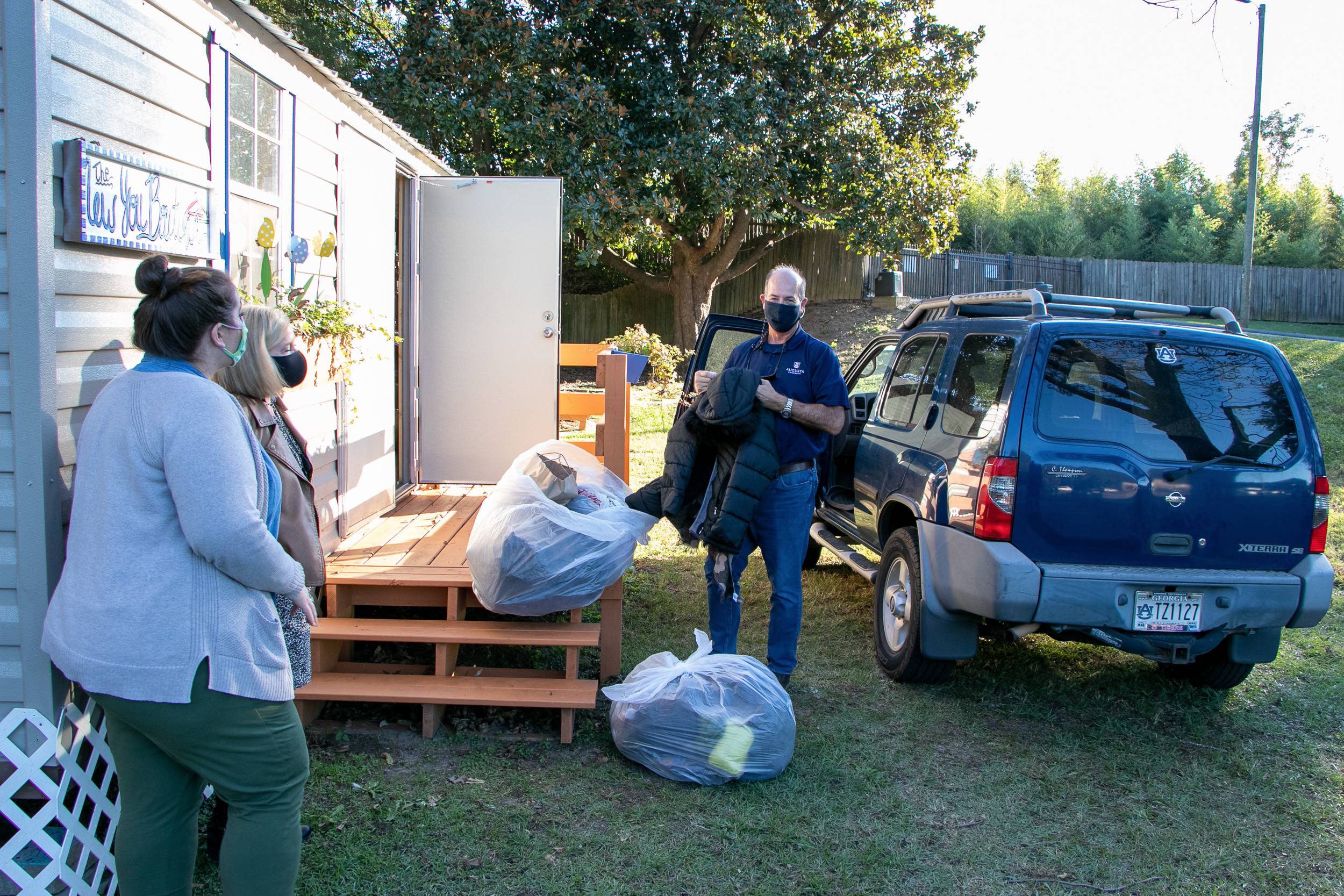 Rodger Duke delivering bags of clothing 