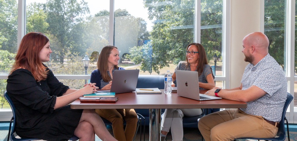 Learning Sxcholars around a table
