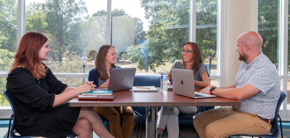 Learning scholars around a table