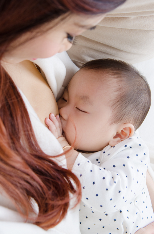 Asian Mother breastfeeding her baby