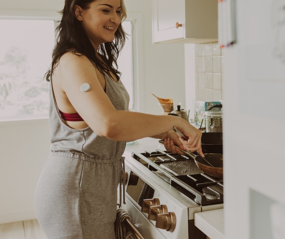 woman wth diabetes patch cooking food