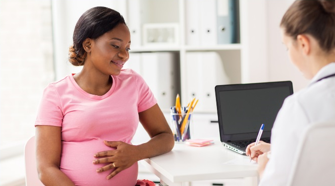 Young woman listening to doctor