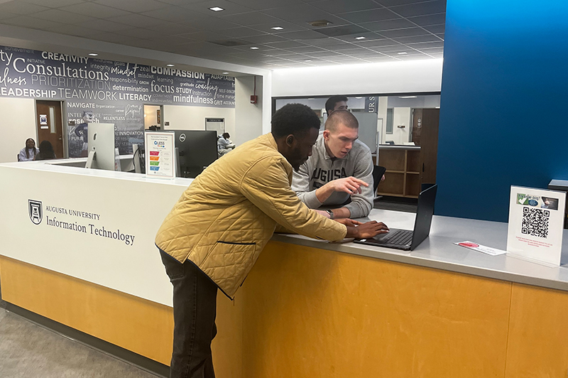 Person standing at the help desk location