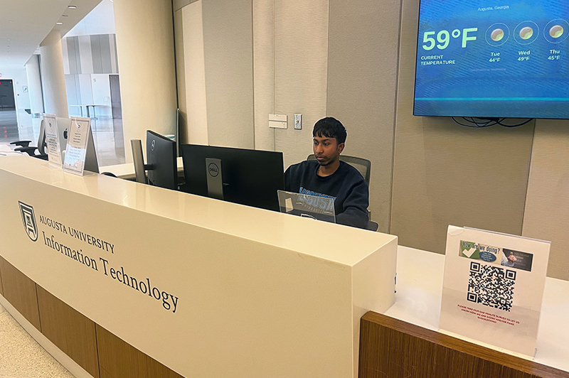 Person standing at the help desk location