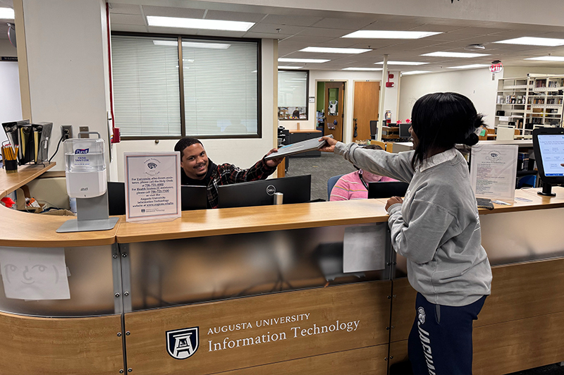 Person standing at the help desk location