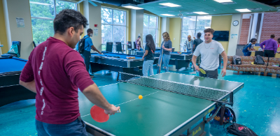 two men playing ping pong