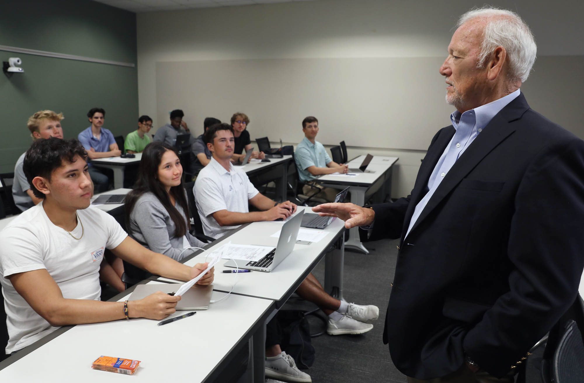 A guest speaker talks with Augusta University students in a classroom.