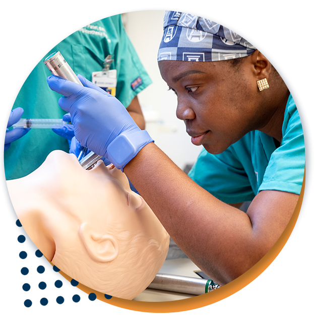 Student practicing intubation in the simulation lab