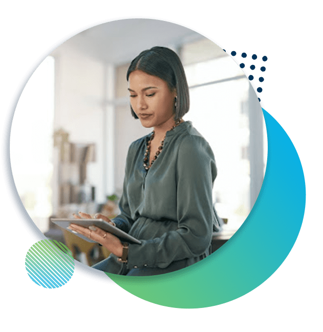 Woman works on an iPad in an office.