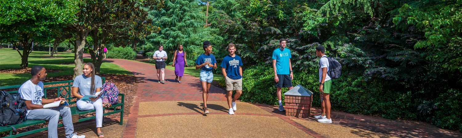 Campus shot of man walking