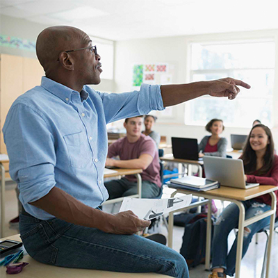 Teacher standing in front of their class