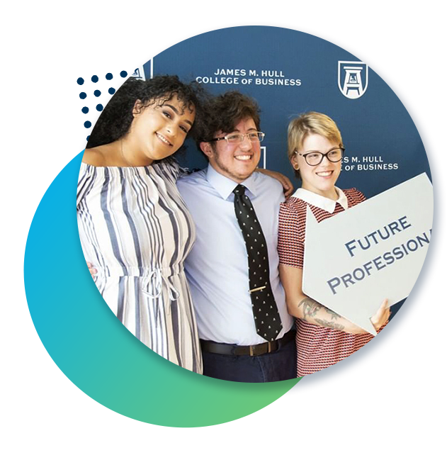 Three students stand in front of a Hull College banner with sign that says Future Professionals