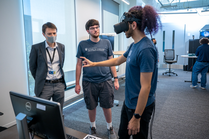 faculty and students working with headgear