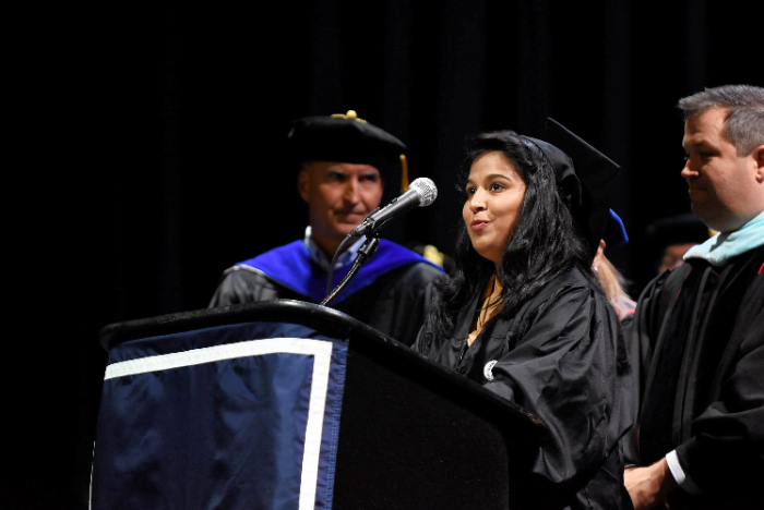 student at microphone