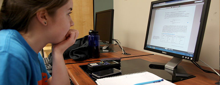 Mac student on computer