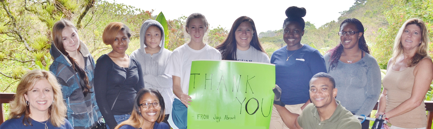AU students abroad with thank you sign