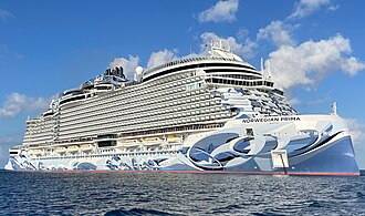 a cruise ship sits atop the water