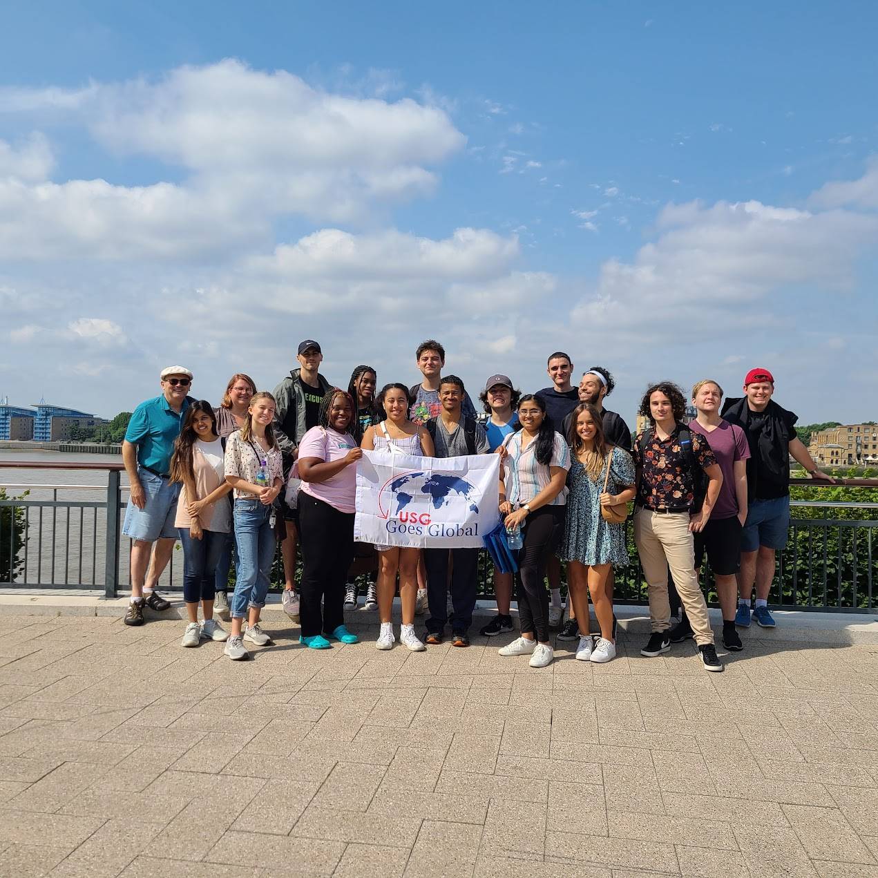 students posing on bridge