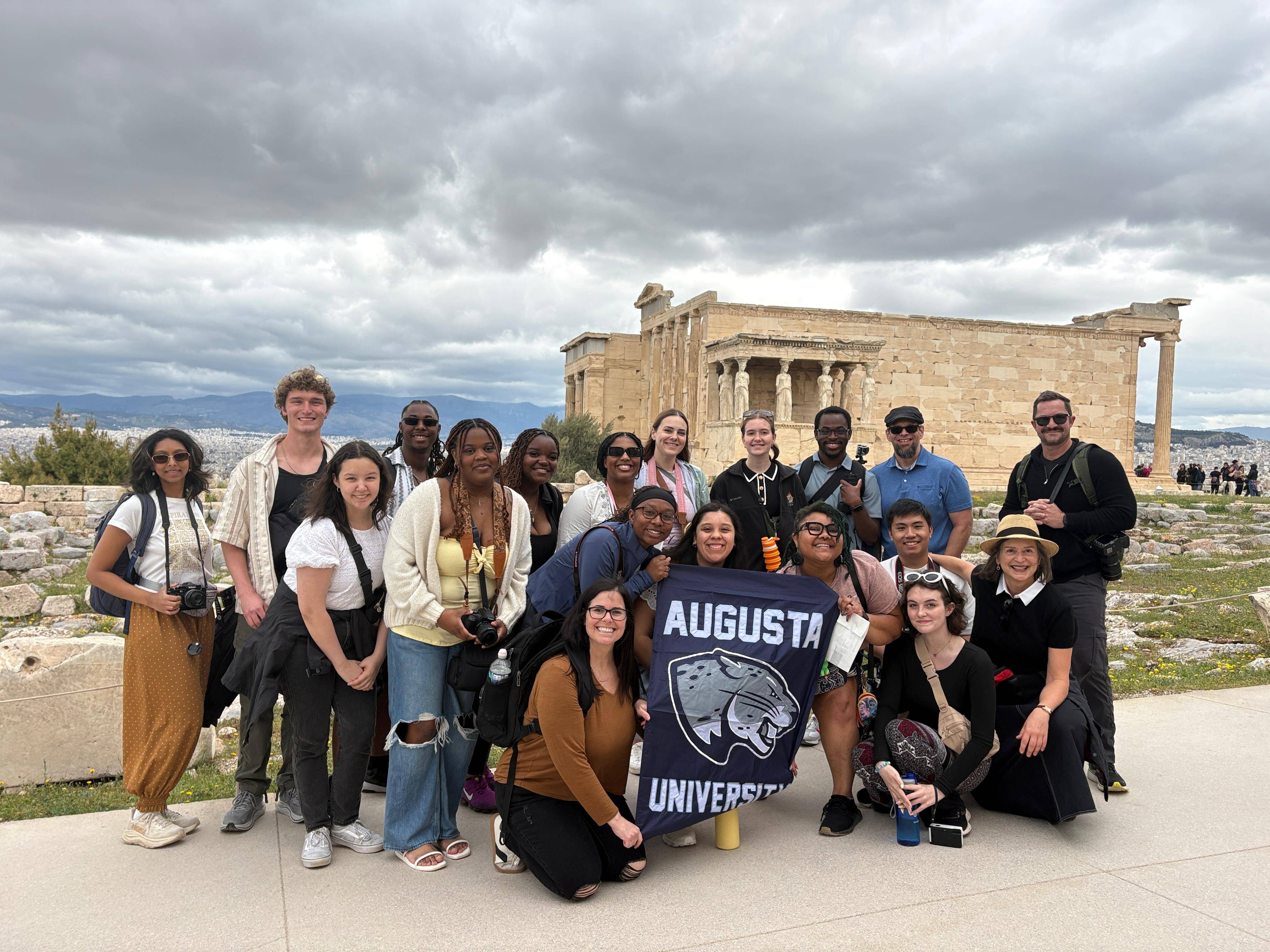 Study abroad students pose for a group photo