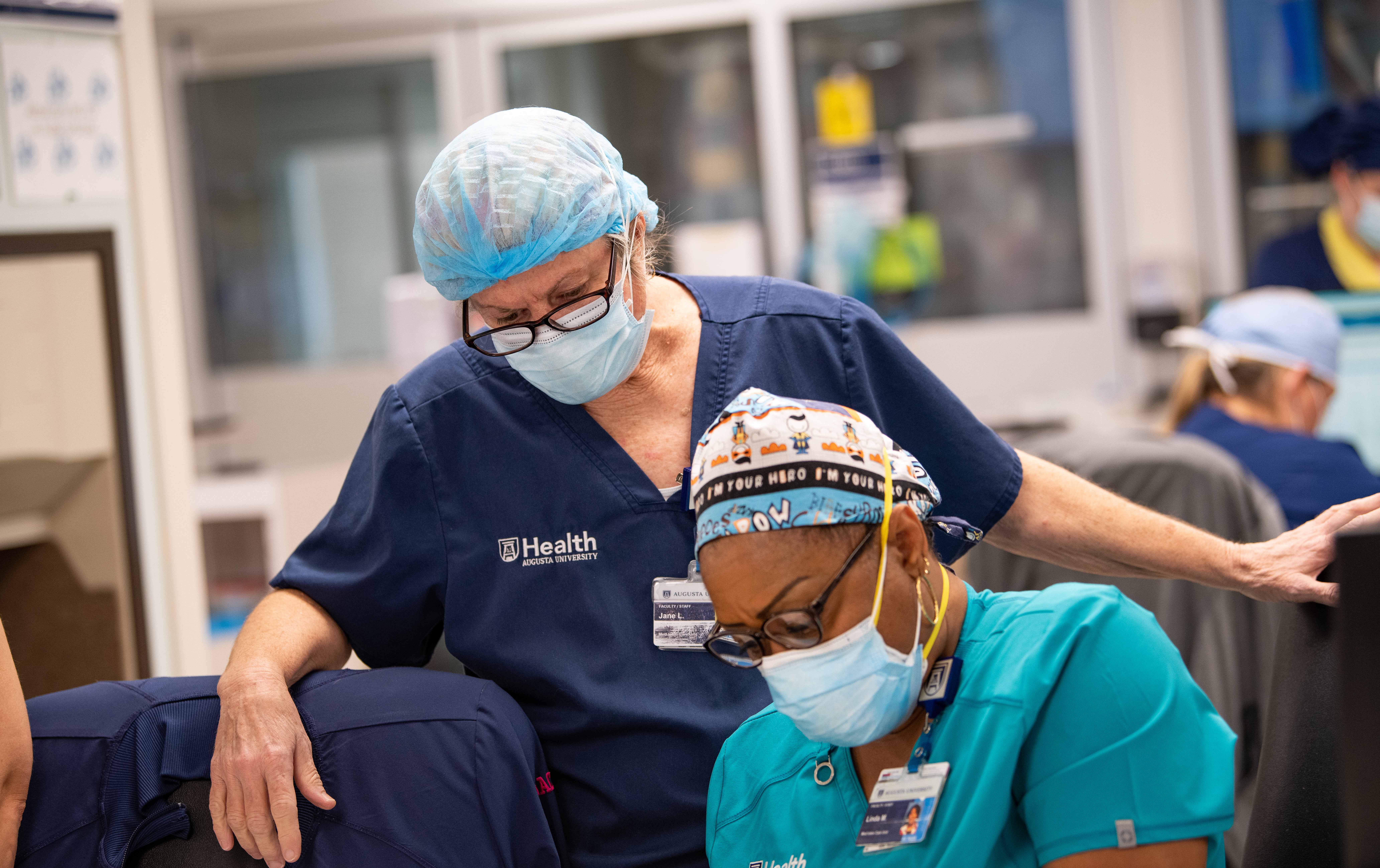 AU Health Staff Discussing Work
