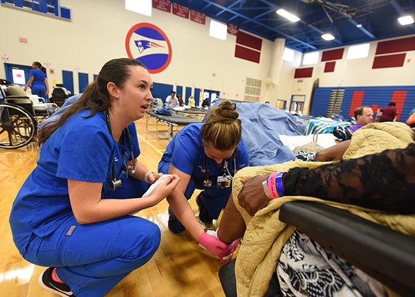 MRC professionals working to help a patient